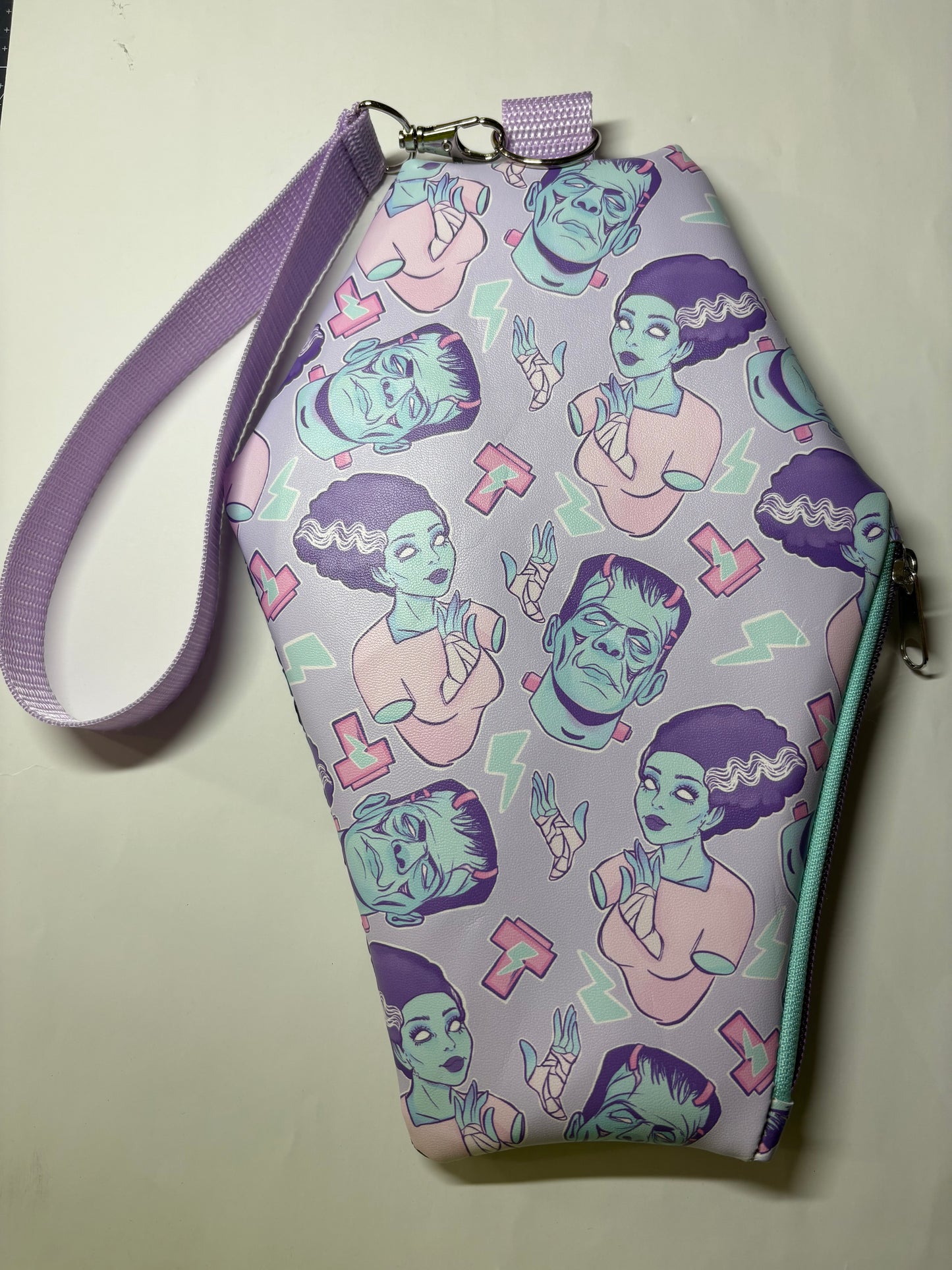 Pastel Frankensteins and bride coffin wristlet