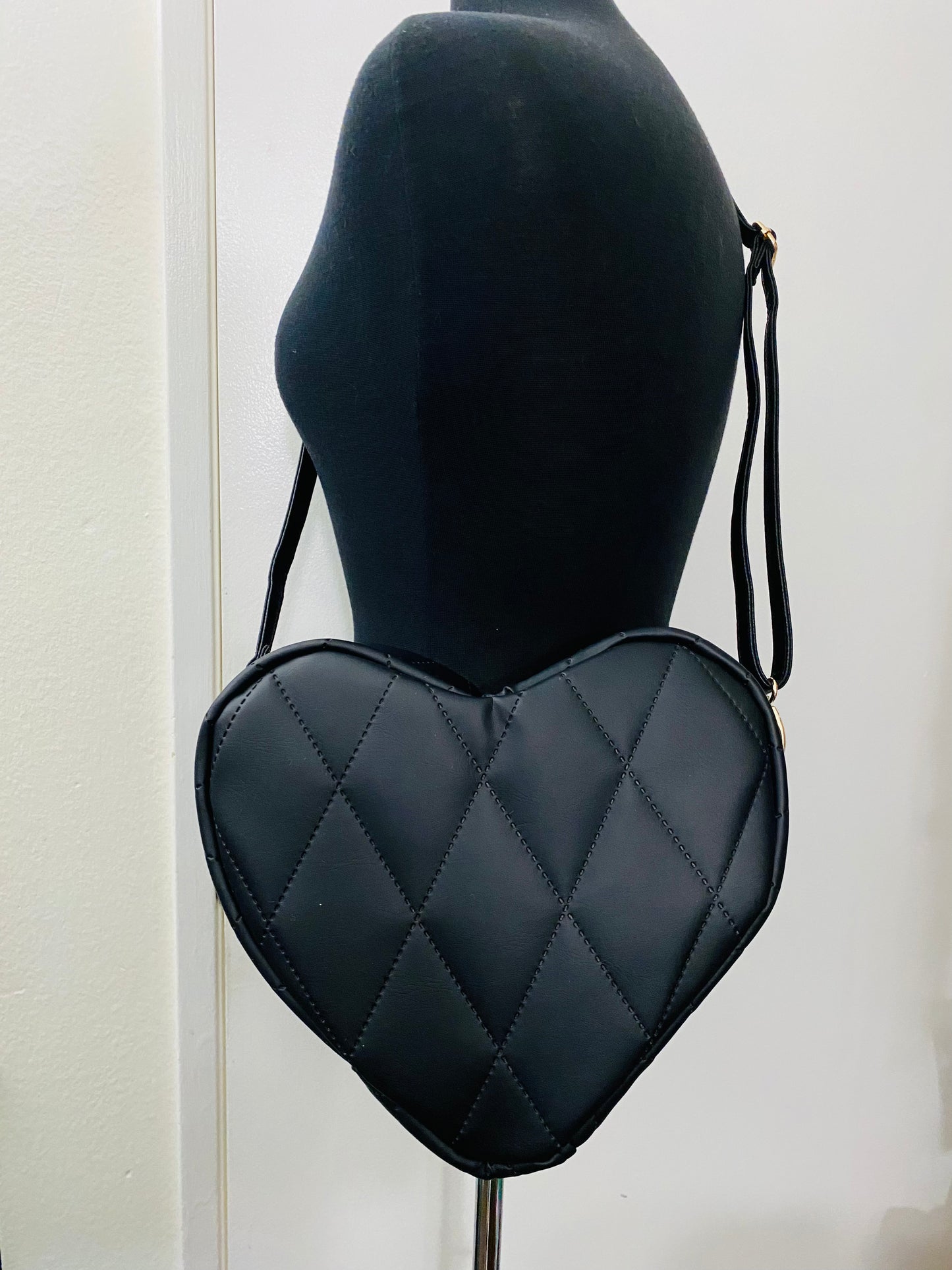 Black quilted heart bag