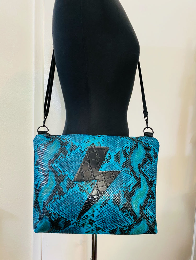 Turquoise lightning croc crossover bag