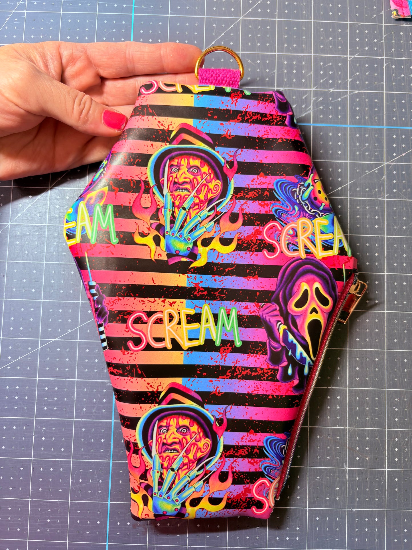 Coffin wristlet pouches