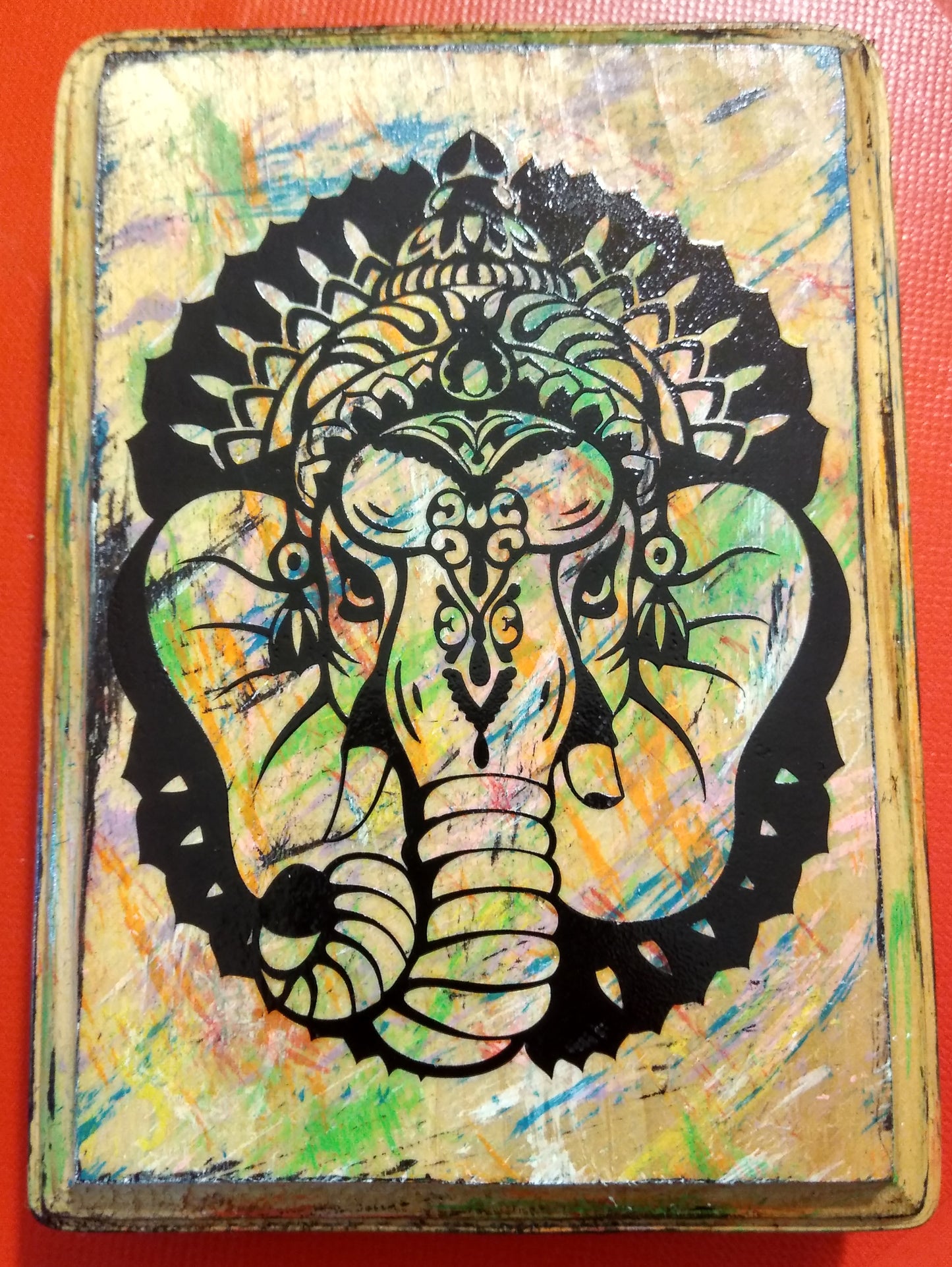 GANESHA ON A WOOD PLAQUE