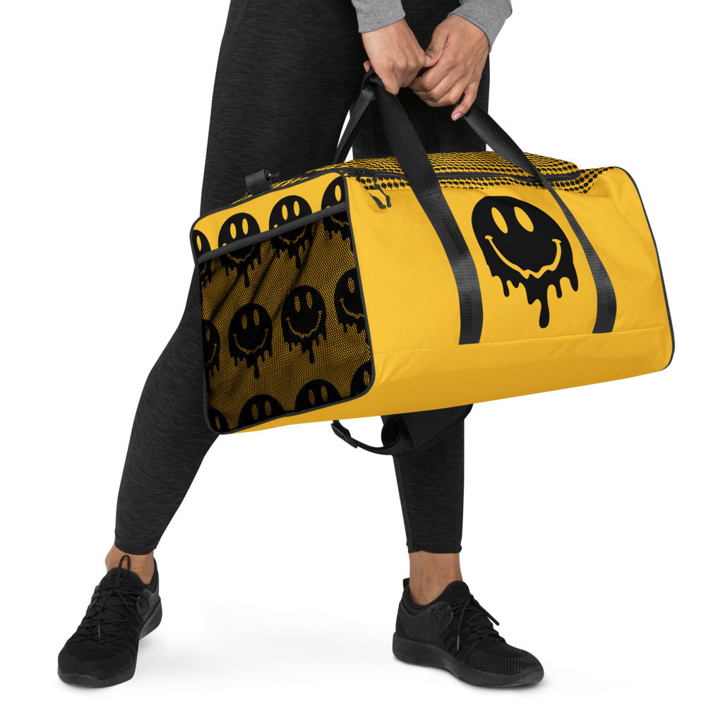 BLACK AND YELLOW MELTY SMILEY DUFFLE