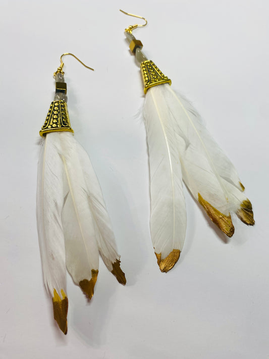 Golden tio feathers in white