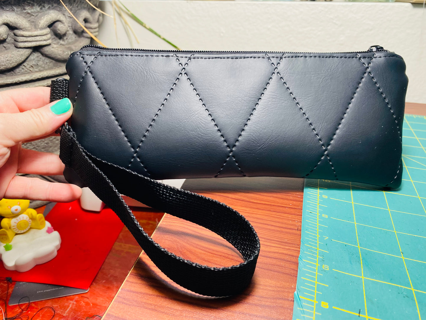 Black quilted wristlet pouch