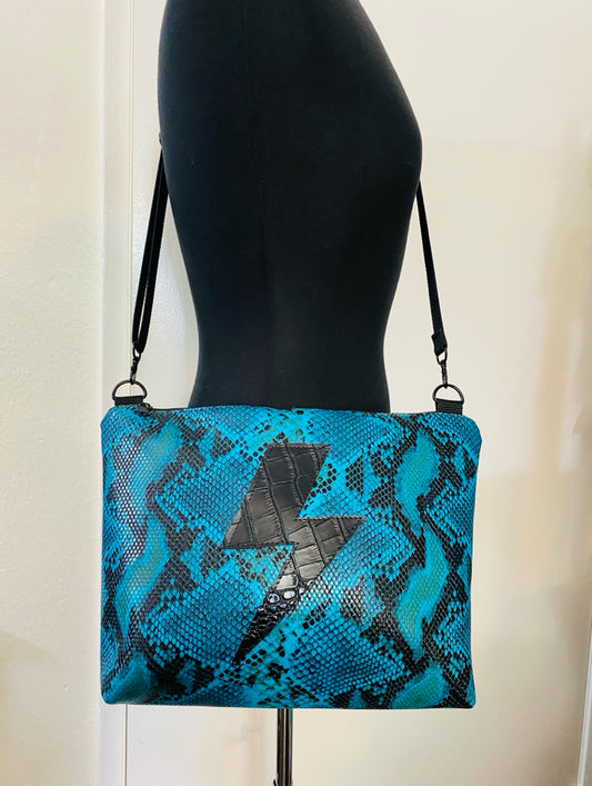 Turquoise lightning croc crossover bag