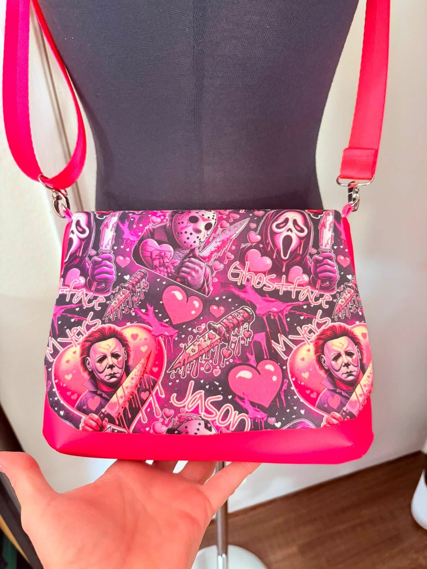 Love bomb Killa’s flap crossbody bag