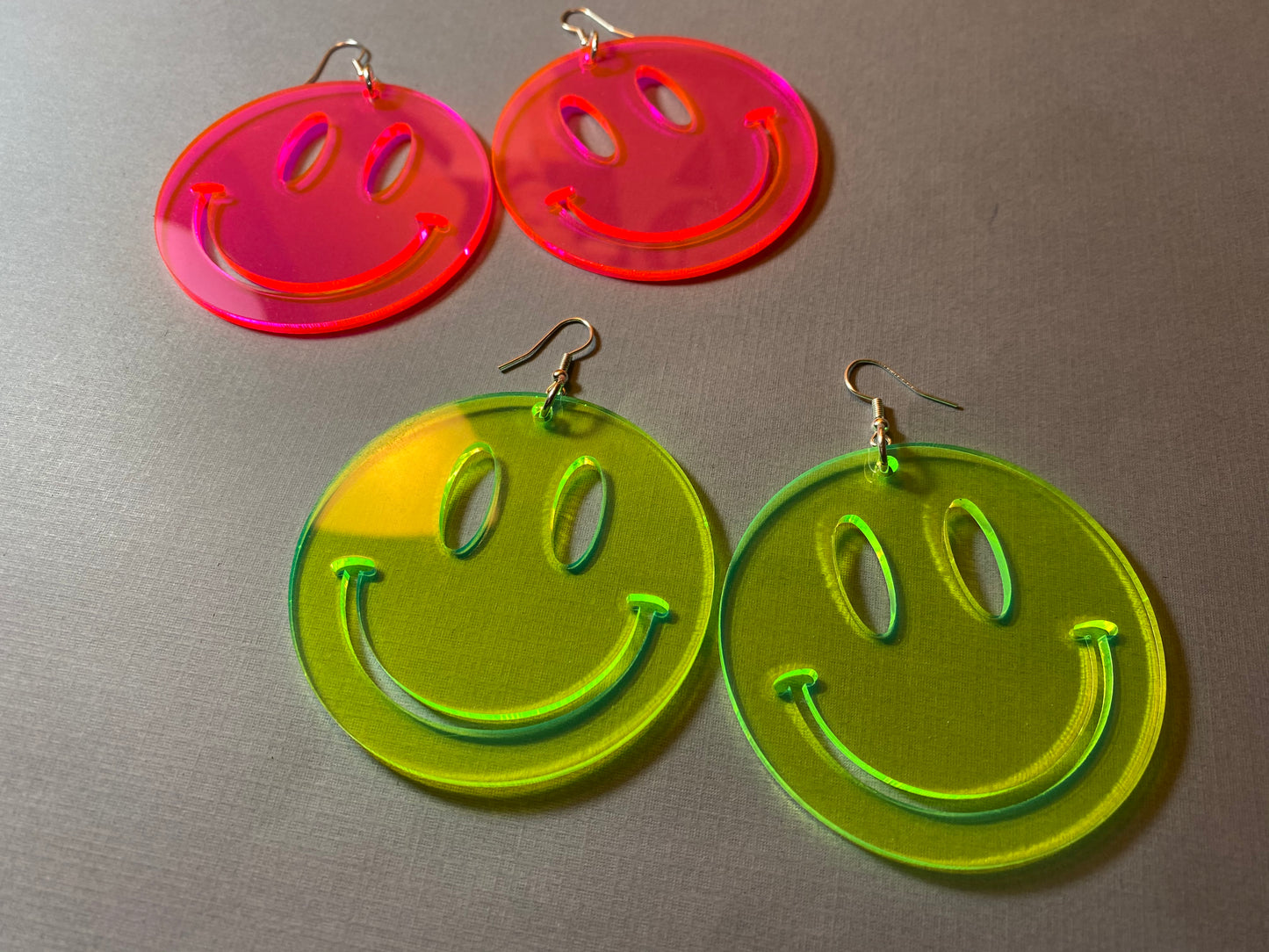big smiley face earrings neon